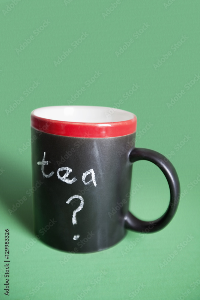 Close-up of coffee mug with text over colored background Close-up of coffee mug with text over colored background