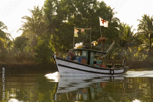 Fishing boats on backwater near Mobor, Goa photo