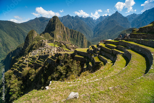 View of the Lost Incan City of Machu Picchu near Cusco, Peru. Machu Picchu is a Peruvian Historical Sanctuary. Terraces can be seen on foreground.