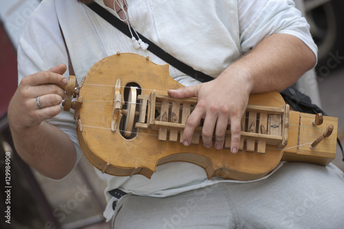 A man plays a Lira, a traditional Russian musical instrument, Kiev, Ukraine photo