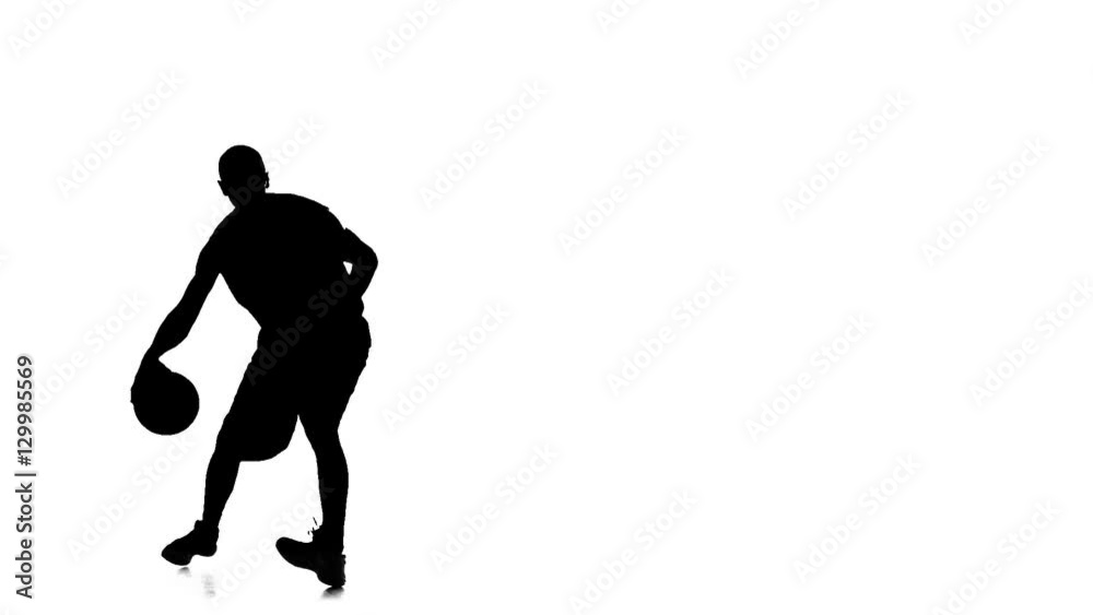 Basketball spinning in a circle and passed the ball to himself. Silhouette Basketball spinning in a circle and passed the ball to himself. Silhouette