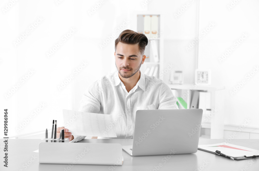 Handsome man working in office