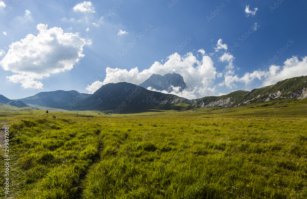Fototapeta premium Panoramic view of beautiful landscape with Gran Sasso d'Italia peak at Campo Imperatore plateau in the Apennine Mountains, Abruzzo, Italy