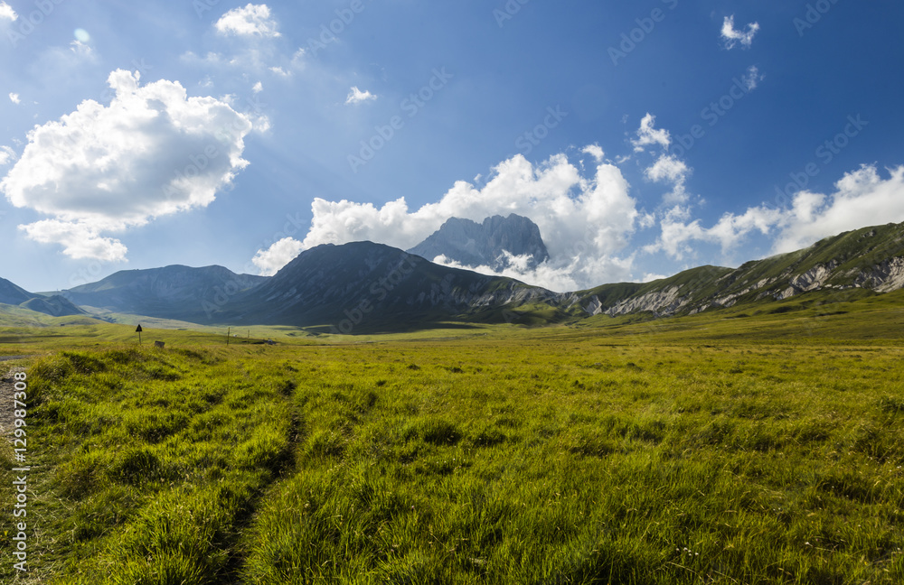 Panoramic view of beautiful landscape with Gran Sasso d'Italia peak at Campo Imperatore plateau in the Apennine Mountains, Abruzzo, Italy