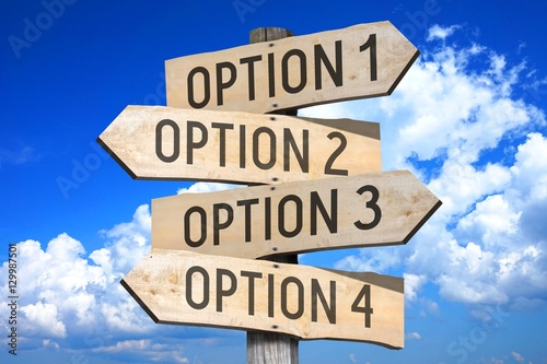 Wooden signpost with four arrows - option 1, option 2, option 3, option 4 - great for topics like choice, making decision etc.
