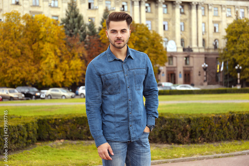 Handsome man on street background
