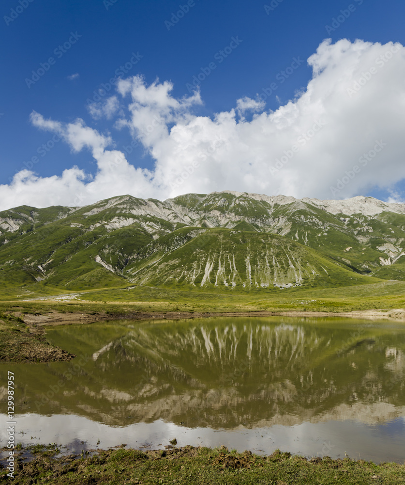 Panoramic view of beautiful landscape with Gran Sasso d'Italia peak at Campo Imperatore plateau in the Apennine Mountains, Abruzzo, Italy