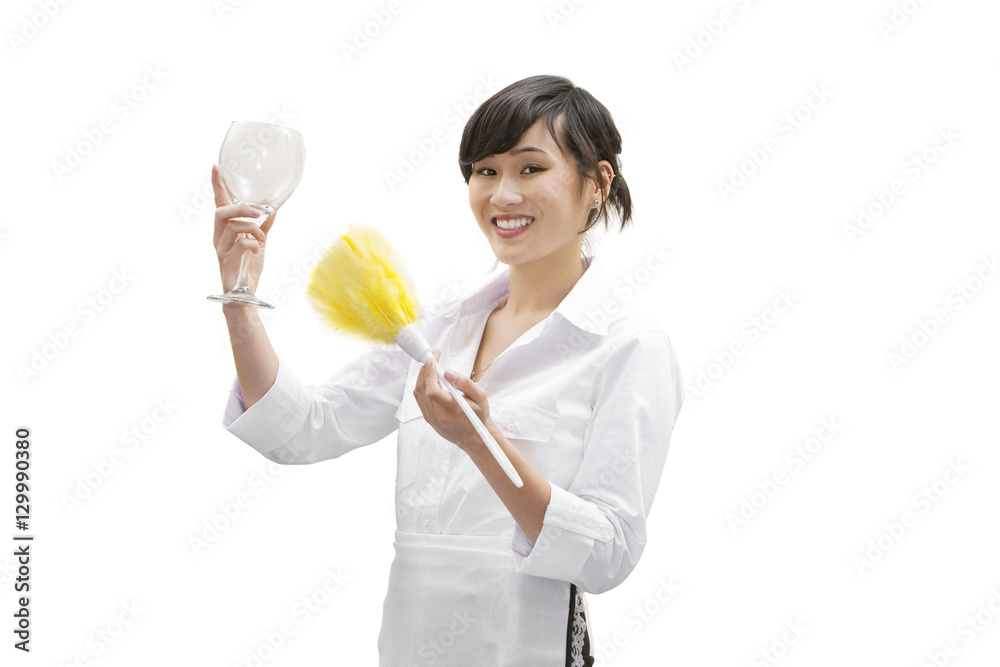 Portrait of a happy female house cleaner dusting glass with feather duster over white background Portrait of a happy female house cleaner dusting glass with feather duster over white background