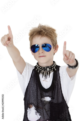 Portrait of punk kid pointing with arms raised over white background