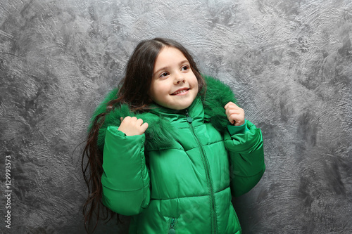 Cute little girl in warm cl...