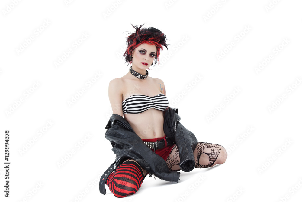 Portrait of beautiful young woman wearing leather jacket over white background Portrait of beautiful young woman wearing leather jacket over white background