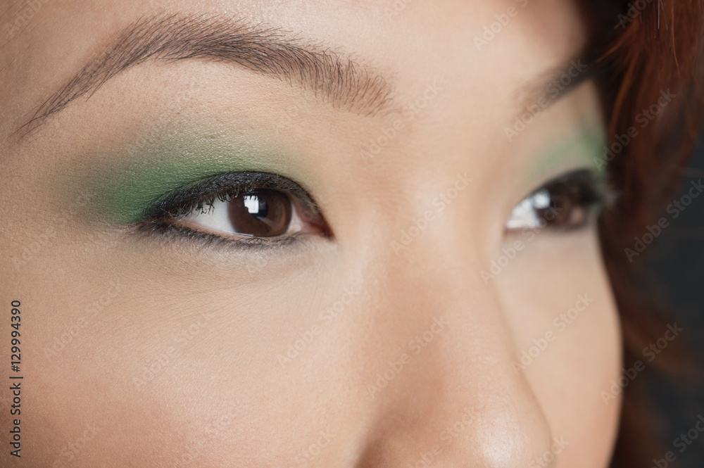 Obraz premium Cropped image of Asian woman looking away