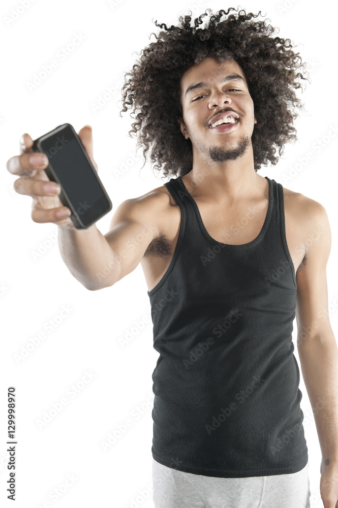 Portrait of a happy young man showing mobile phone over white background Portrait of a happy young man showing mobile phone over white background