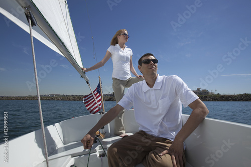 Young couple sailing in boat © moodboard
