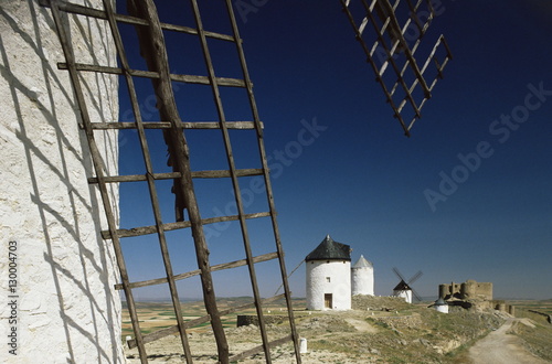 Windmills and castle, Consuegra, Toledo, Castile La Mancha, Spain photo