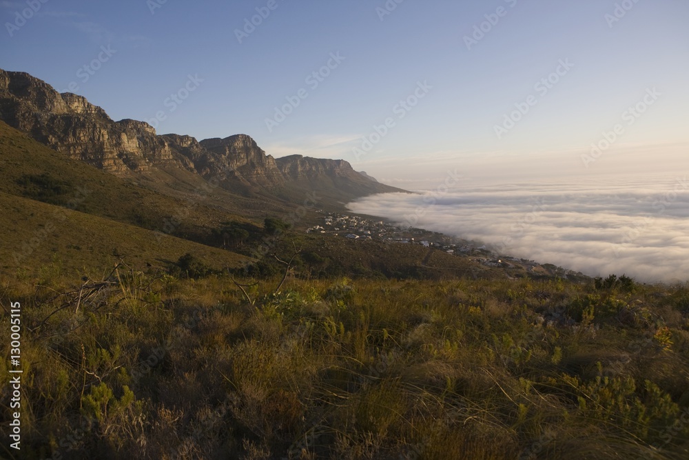 The 12 Apostles of Table Mountain tower above Camps Bay and Bakoven