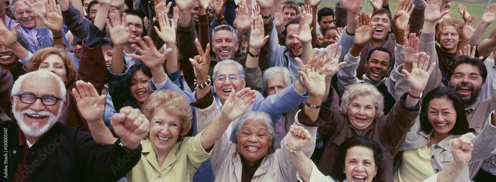Large group of multi-ethnic people cheering with arms raised - obrazy, fototapety, plakaty 