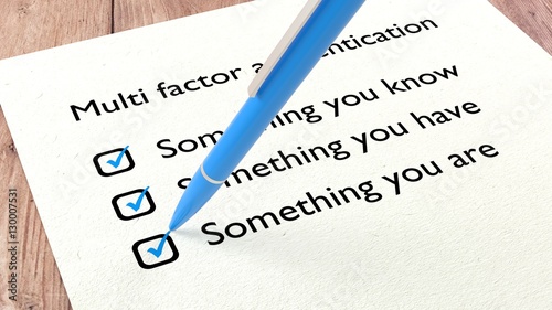 Multi factor authentication checklist with a pen photo