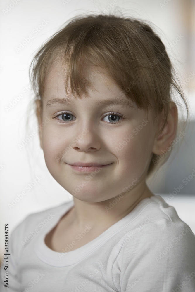 Portrait of beautiful girl smiling at home