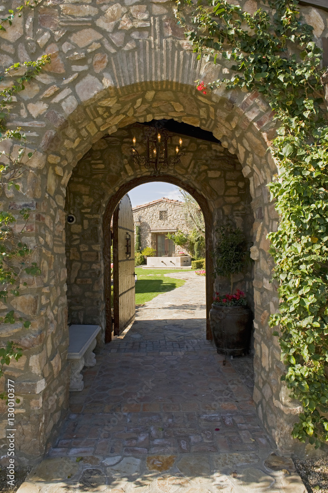 View of arched walkway with open door