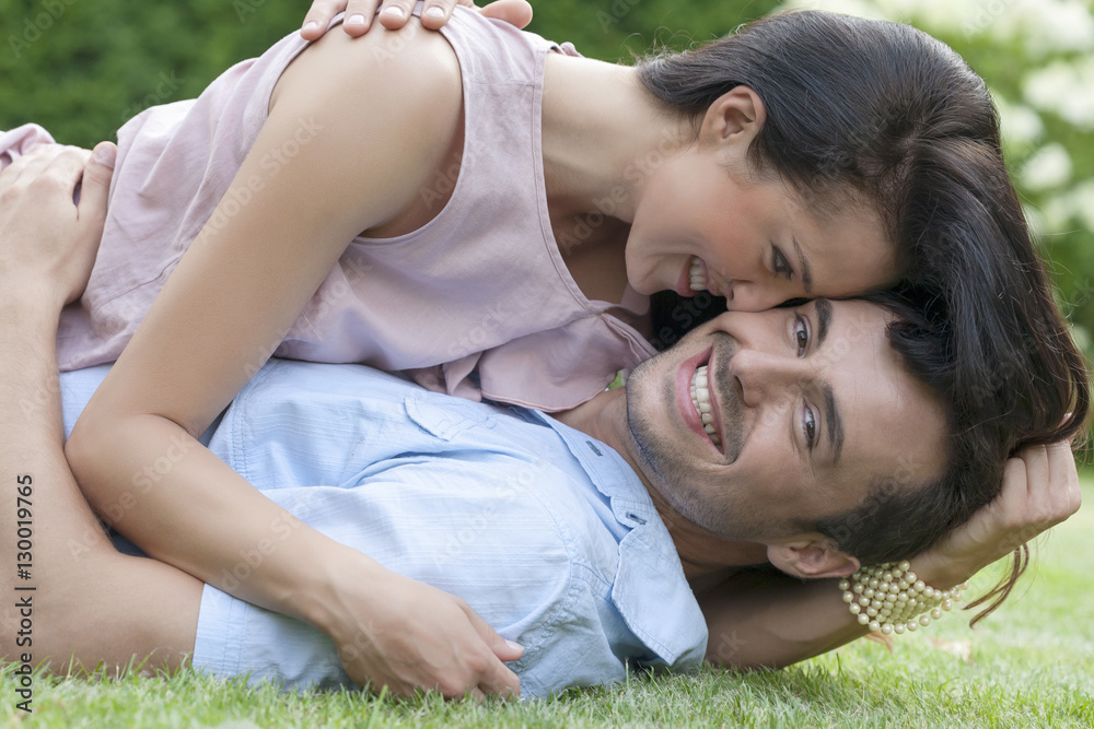 Portrait of loving young couple enjoying together in park Portrait of loving young couple enjoying together in park