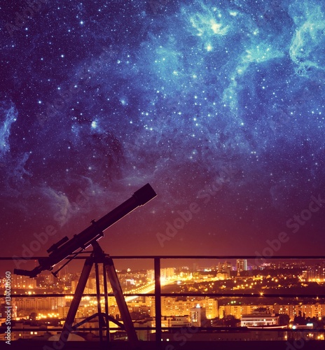 Silhouette of Telescope on background stars and night city. Elements of this image furnished by NASA.