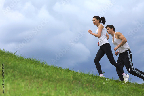 Young couple exercising in park