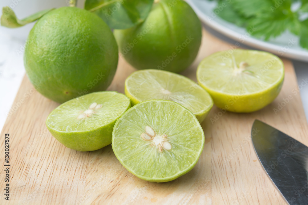 green lemon fresh on cutting boards and knives green lemon fresh on cutting boards and knives