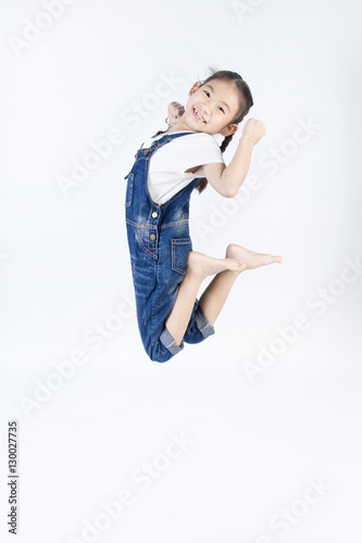 Asian cute child is jumping