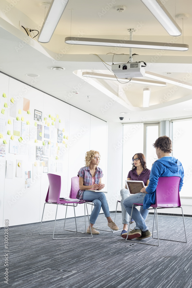 Businesspeople working at creative office space Businesspeople working at creative office space