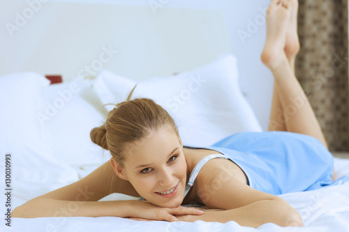 Woman relaxing in bed