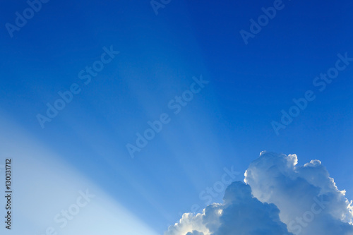 light rays on clear blue sky background