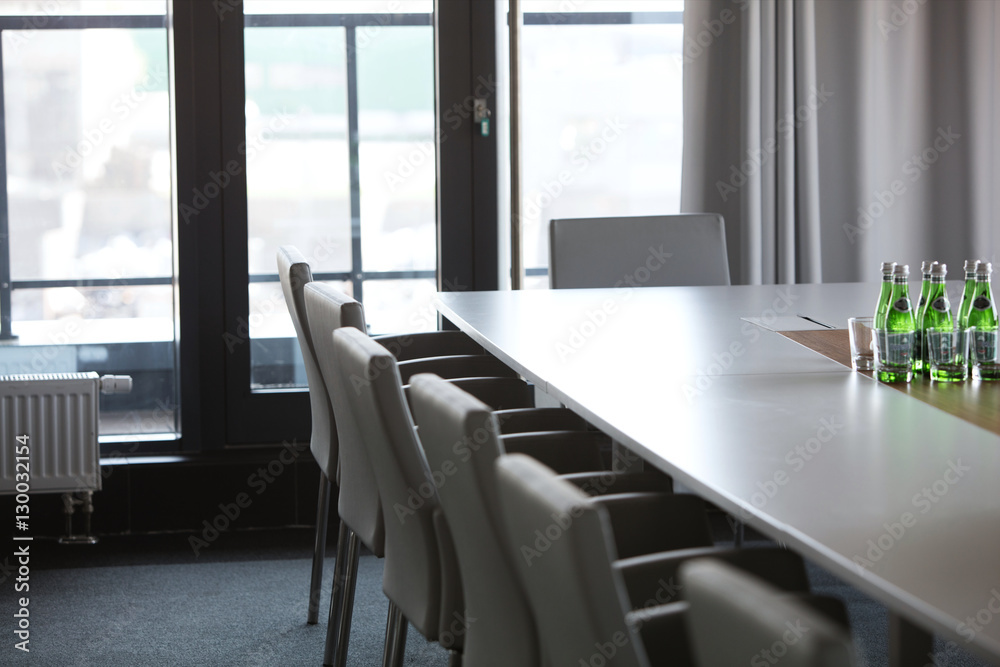 Chairs at conference table in modern office