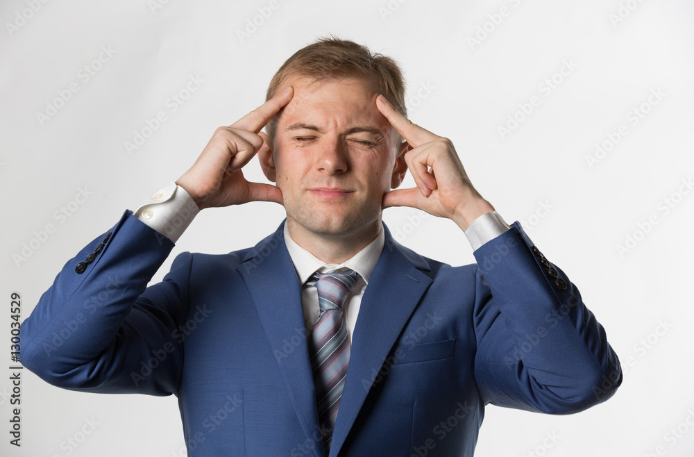 Businessman holding head with a headache Businessman holding head with a headache