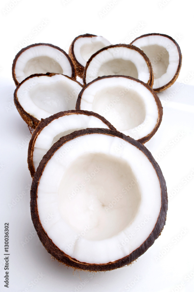 Studio shot of halved coconuts Studio shot of halved coconuts