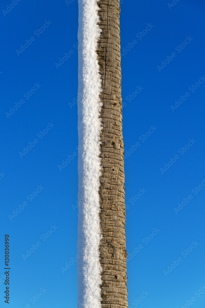 Pillar with snow.