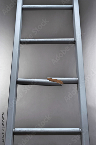 Vászonkép Ladder with one step broken