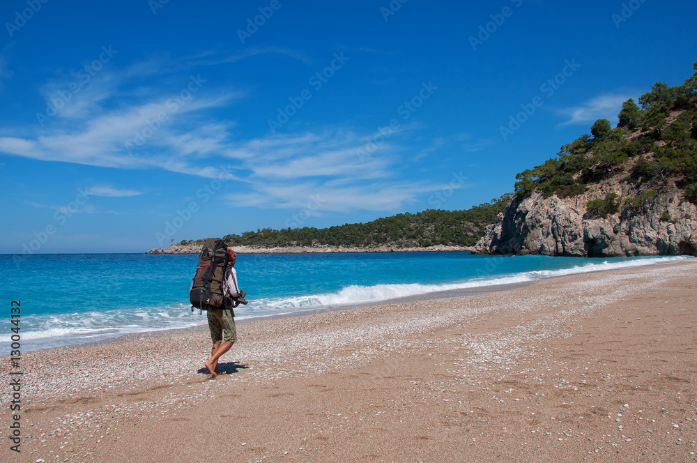 young man on paradise beach the Lycian trail in Turkey.