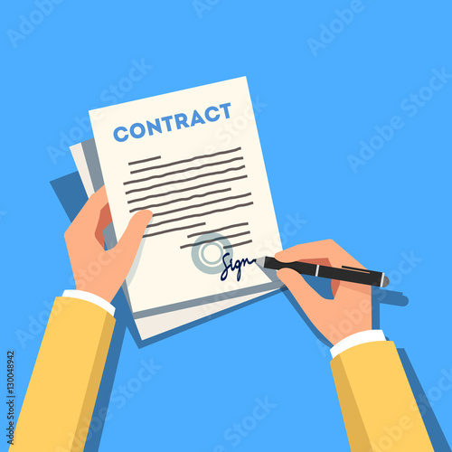 Фотография Hands holding and signing business contract pape