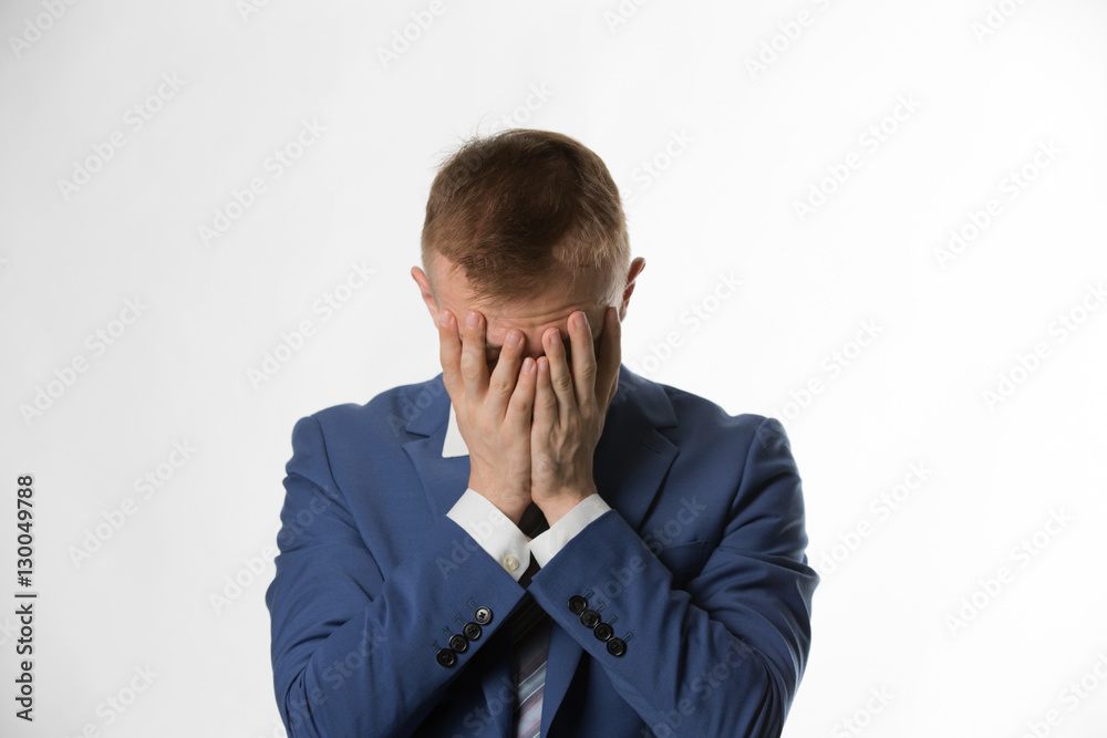 depressed businessman with holding his head in hands depressed businessman with holding his head in hands