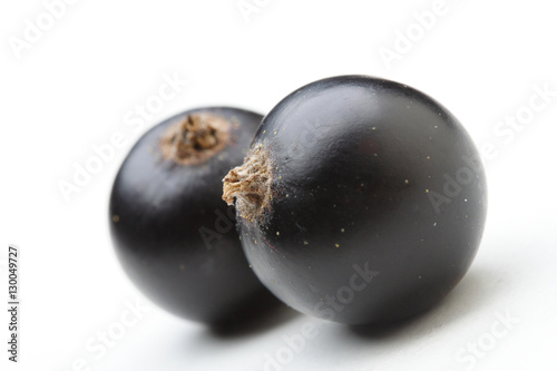Close - up of blackcurrants on white background