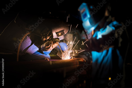 Welding at the industrial factory or steel production heavy industrial concept with Blur background of welder in construction work