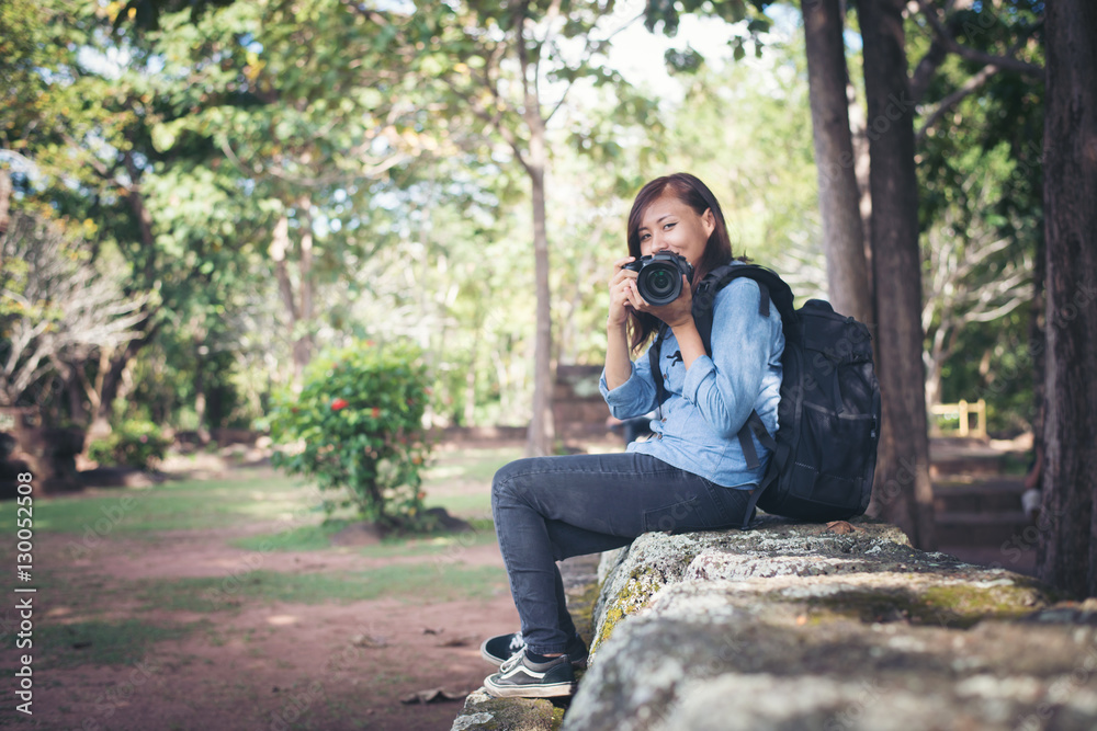 Young attractive woman photographer tourist with backpack. Young attractive woman photographer tourist with backpack.
