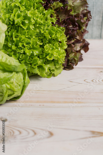 Variety of green and red fresh lettuce salad leaves - healthy vegetables