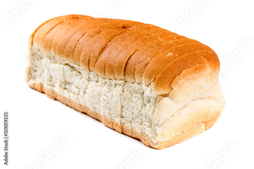 Loaf of whole grain bread isolated on white background