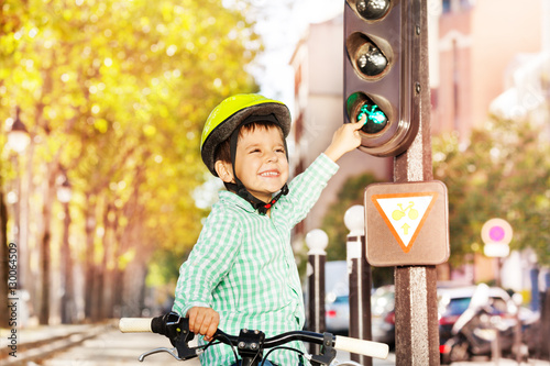 фотографія Boy cycling on his bike and learning traffic rules