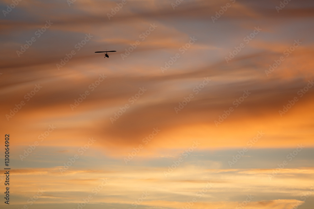 Red sky with hang glider