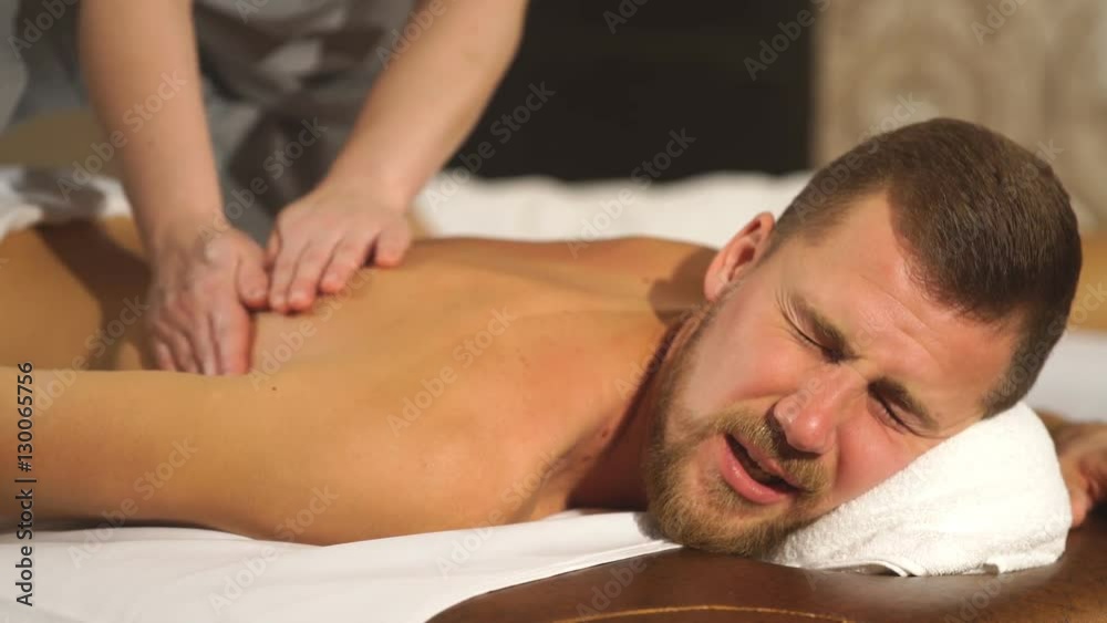 young man relaxing back massage young man relaxing back massage