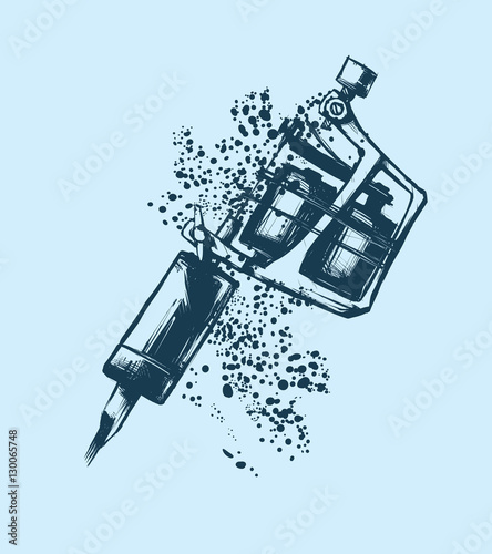Tattoo machine on blue background