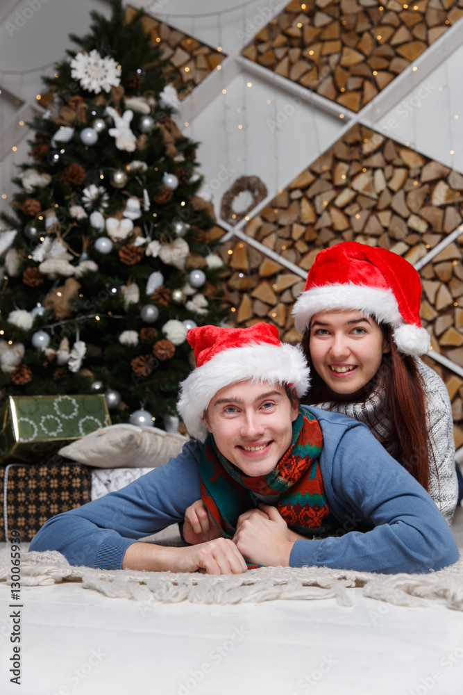 Christmas couple lies on plaid Christmas couple lies on plaid